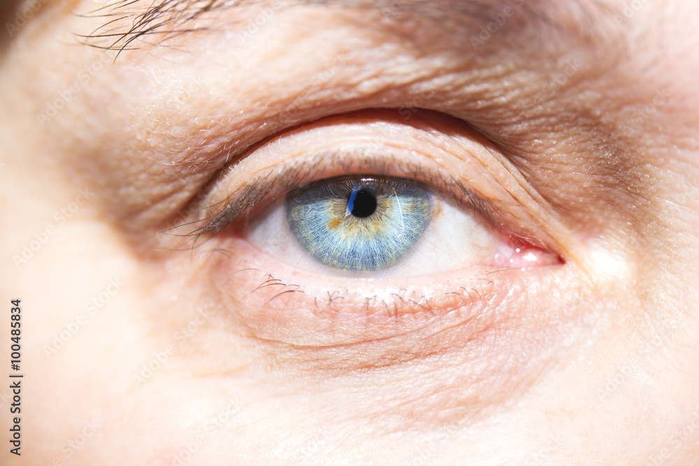 Obraz premium Beautiful mature woman blue eyes closeup