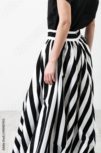 Young woman in black and white clothes