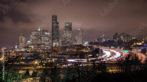 Time lapse of traffic on the freeway looking toward Skyscrapers in Seattle and Centurylink Field. photo