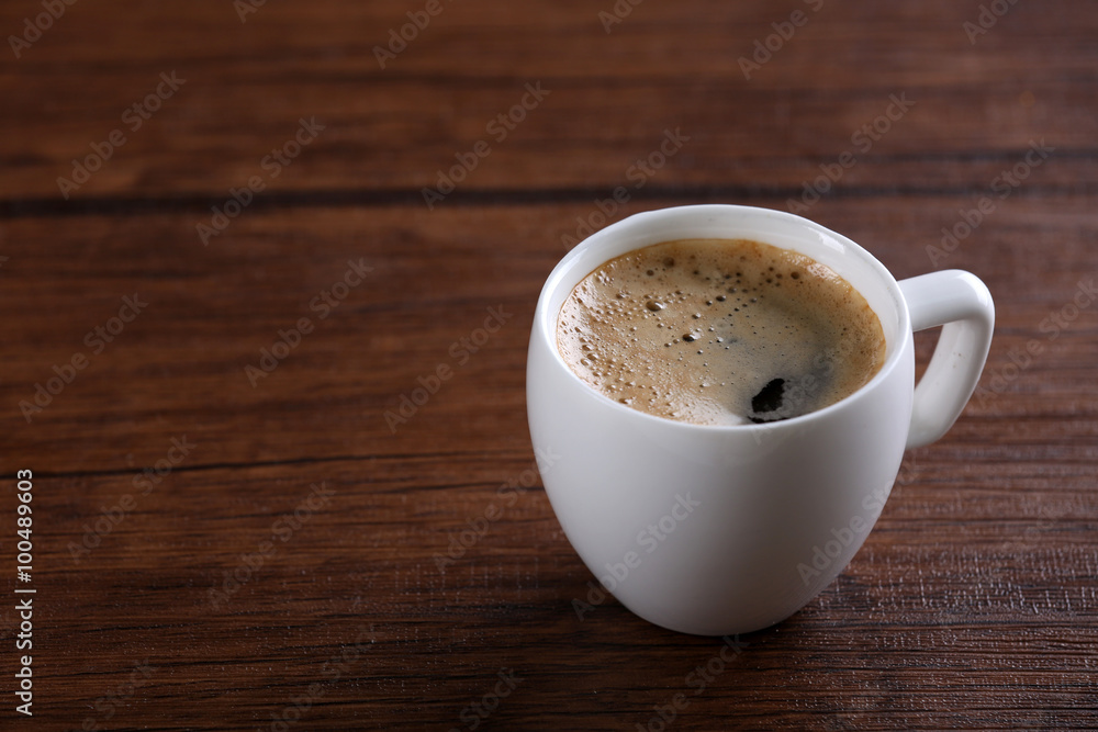 Obraz premium Cup of coffee on table close up
