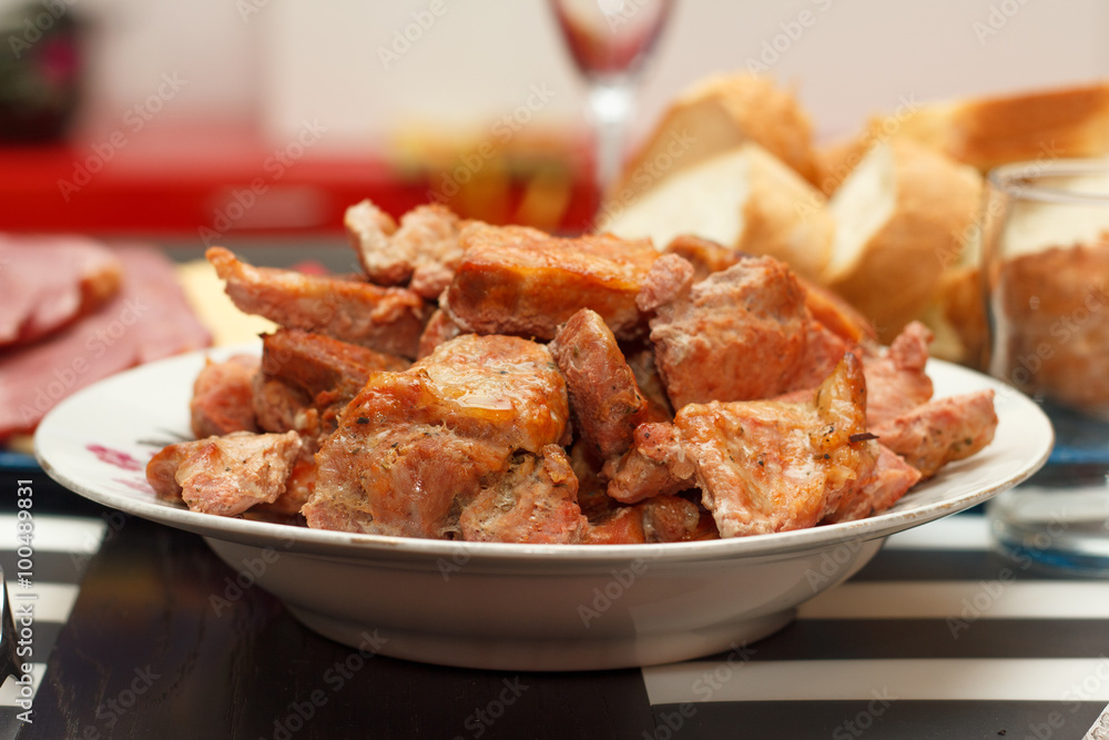 Juicy meat on white plate Juicy meat on white plate