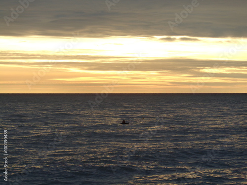 Small boat in the sea at sunset © lana4ka