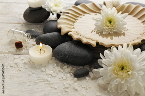 Spa composition and treatments on light wooden background  close-up