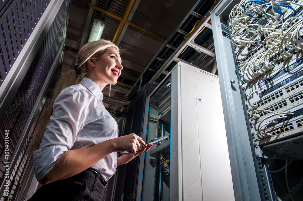 Young engineer businesswoman in network server room Young engineer businesswoman in network server room