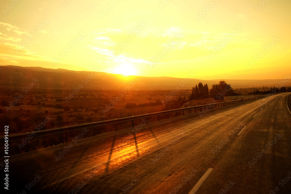 Beautiful golden sunrise over the road