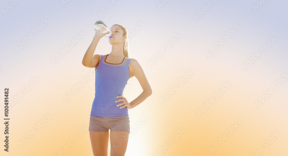 Composite image of fit woman with water