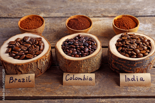 Collection of coffee beans on old wooden table  close up