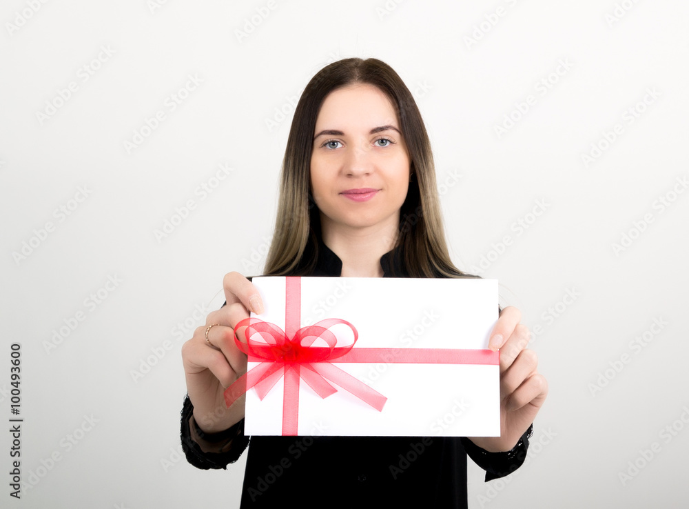 beautiful girl with an envelope tied with a ribbon