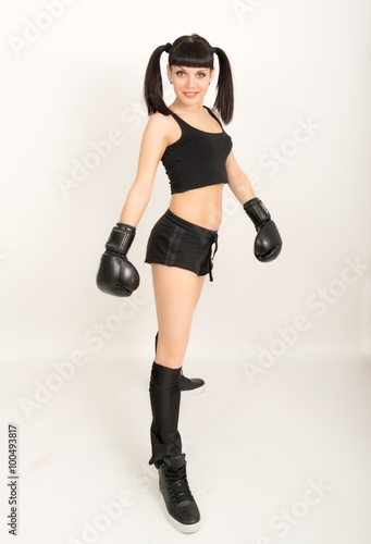 female boxer, fitness woman boxing wearing boxing black gloves