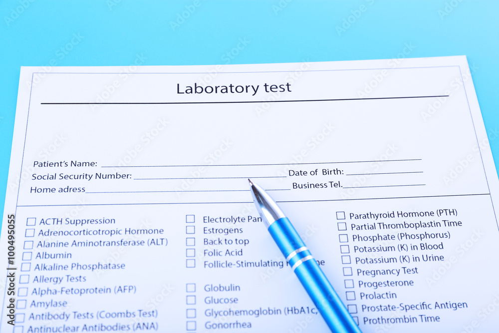 Laboratory test list with pen on blue background, close up Laboratory test list with pen on blue background, close up