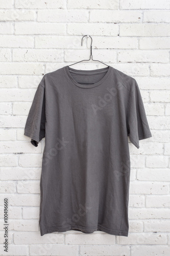 grey t-shirt hanging on the wall