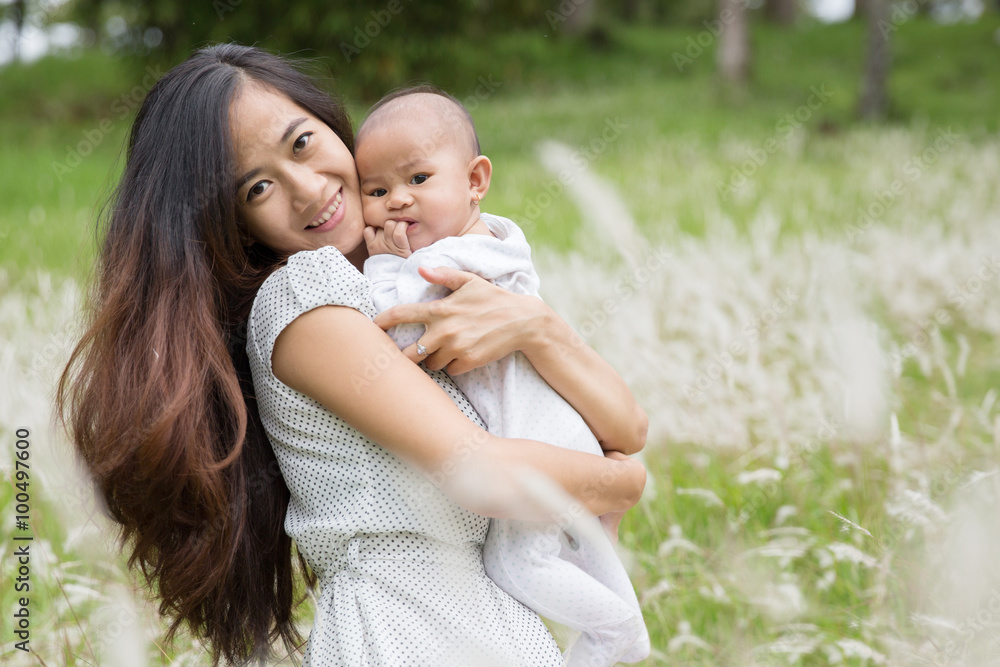 mother and her baby having fun together outdoor mother and her baby having fun together outdoor
