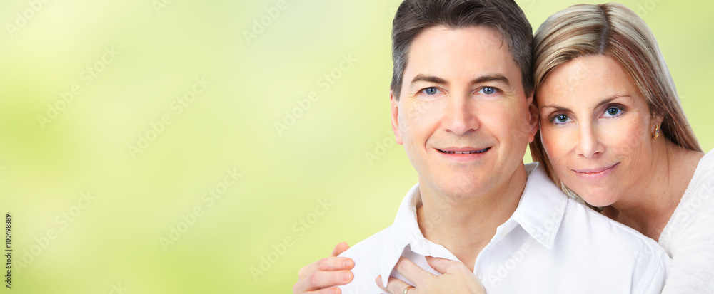 Happy loving couple over blue background. Happy loving couple over blue background.
