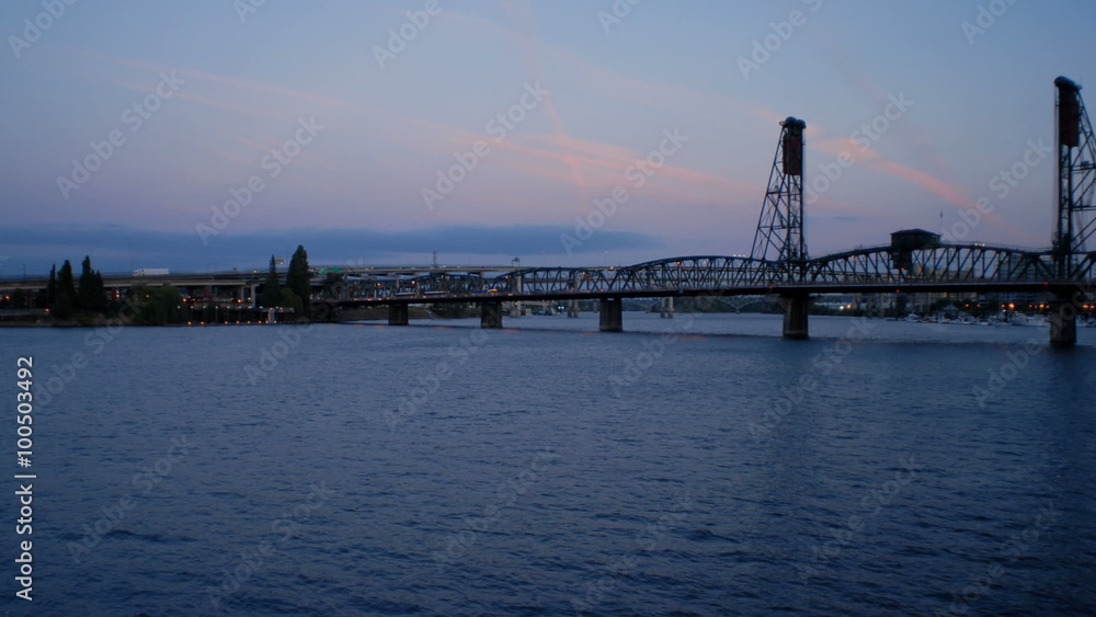 Time-lapse of a long bridge over a large river. Time-lapse of a long bridge over a large river.
