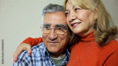 Senior couple sitting on sofa