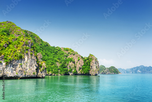 Scenic karst isles on blue sky background in the Ha Long Bay