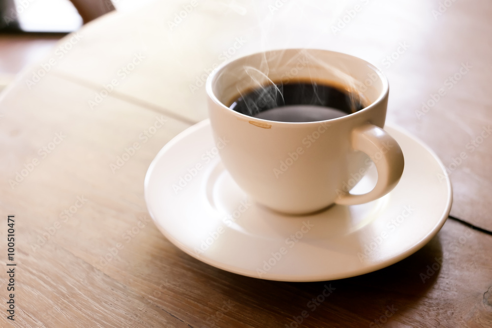Cup of coffee on wooden table Cup of coffee on wooden table