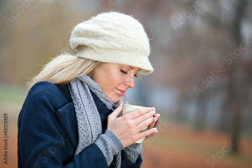 Young woman drinking tea © djoronimo