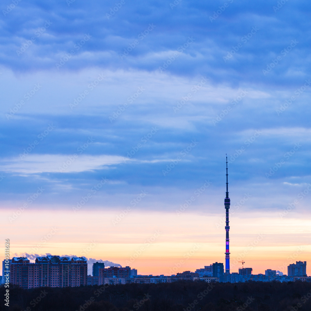 Early blue sunrise and cityscape with TV tower