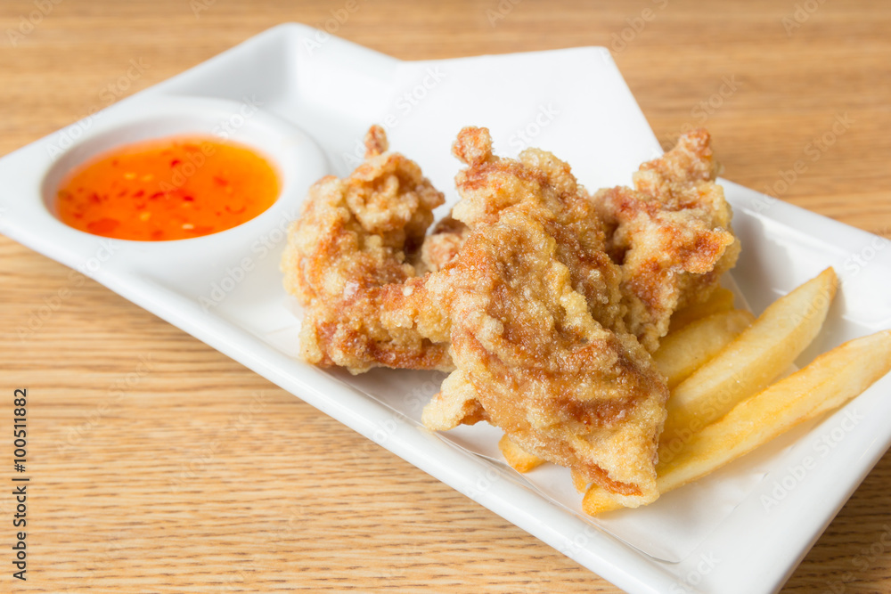 fried chicken with french fries and sweet sauce on plate fried chicken with french fries and sweet sauce on plate