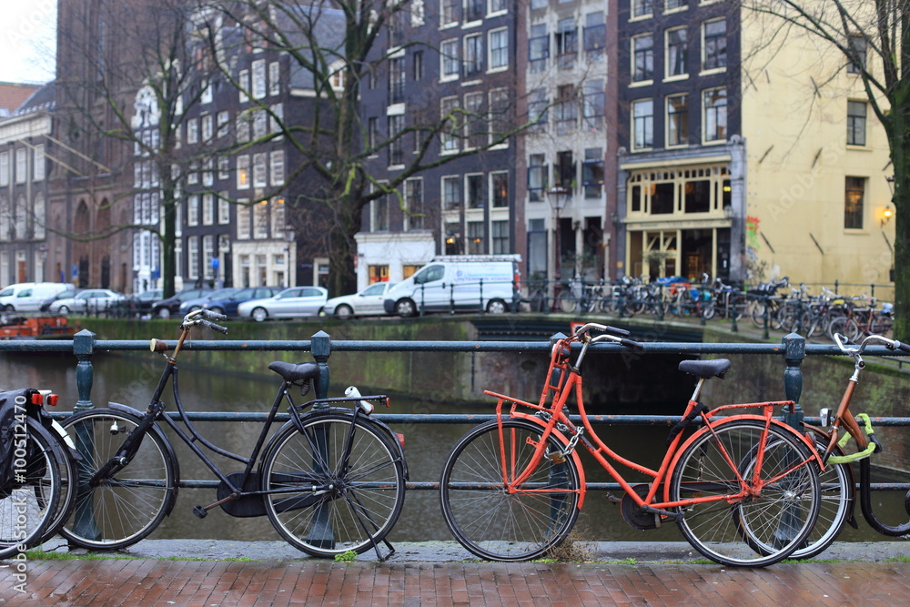 Bicycles lining a bridge over the canals of Amsterdam, Netherlands