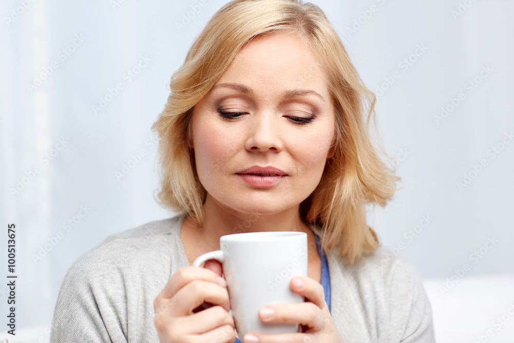 woman with cup of tea or coffee at home woman with cup of tea or coffee at home