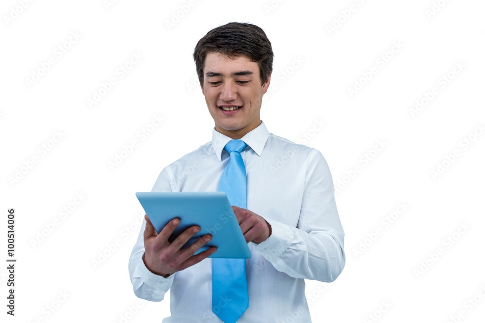 Smiling asian businessman using his tablet