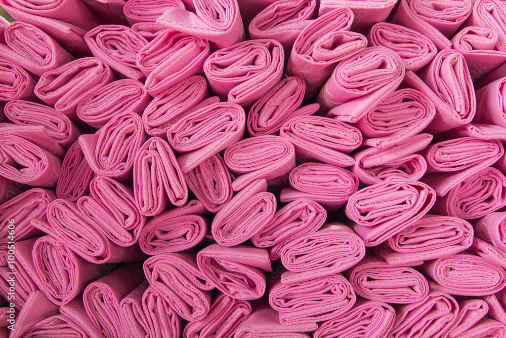 Stack of pink fabric on the table. Stack of pink fabric on the table.