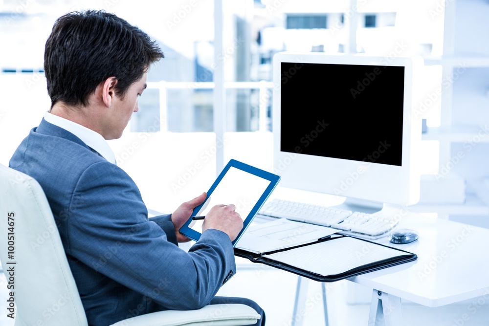 Businessman using his tablet Businessman using his tablet