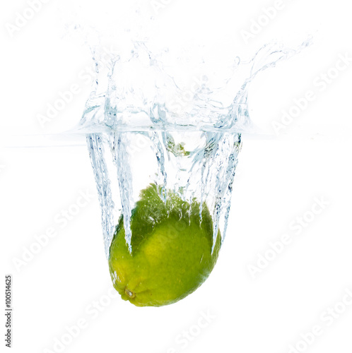 lime falling or dipping in water with splash