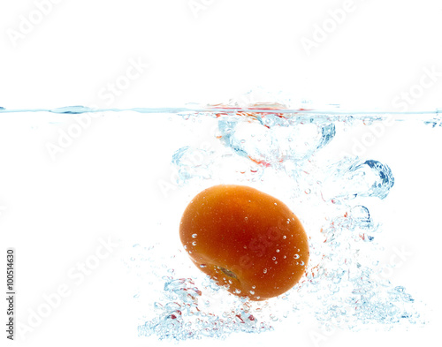 tomato falling or dipping in water with splash