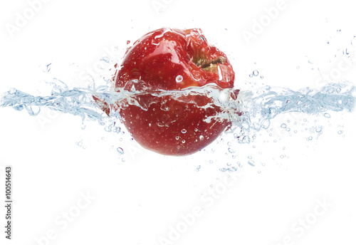 apple falling or dipping in water with splash