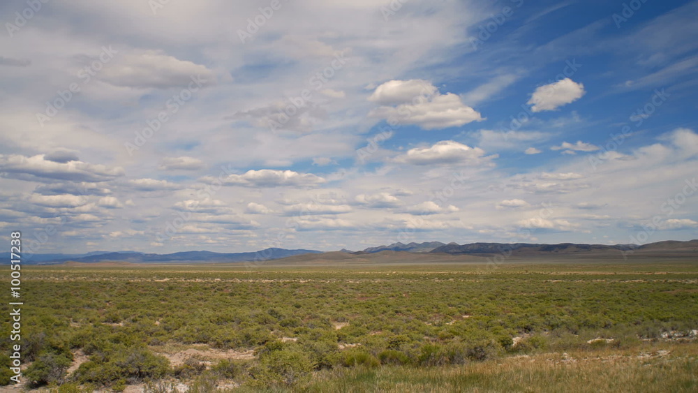 Time-lapse of grassy plain and clouds landscape. Time-lapse of grassy plain and clouds landscape.