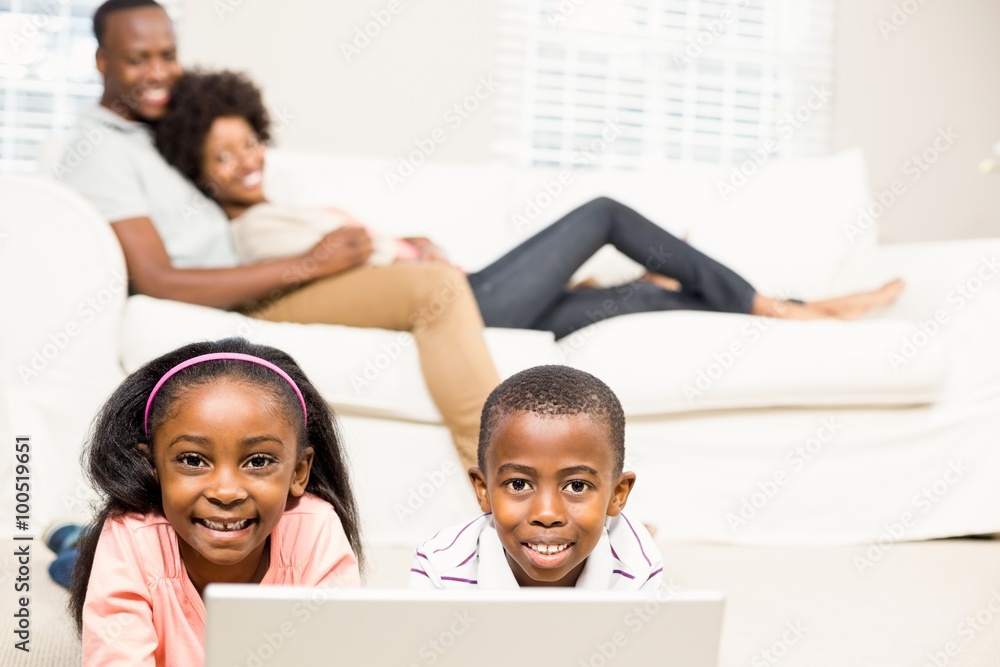 Fototapeta premium Happy kids using laptop pc