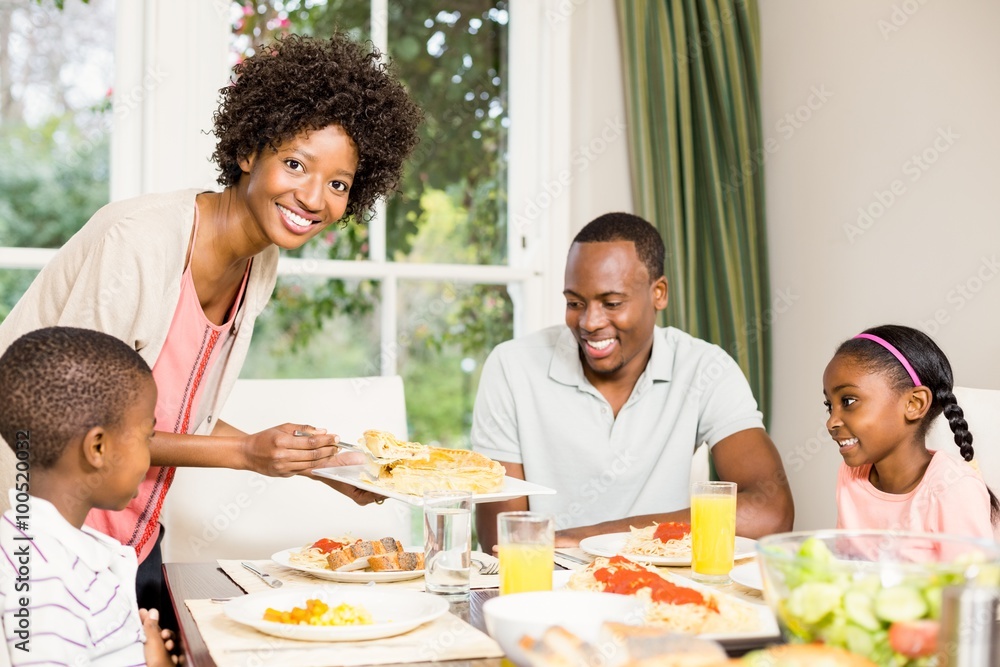 Happy family eating together