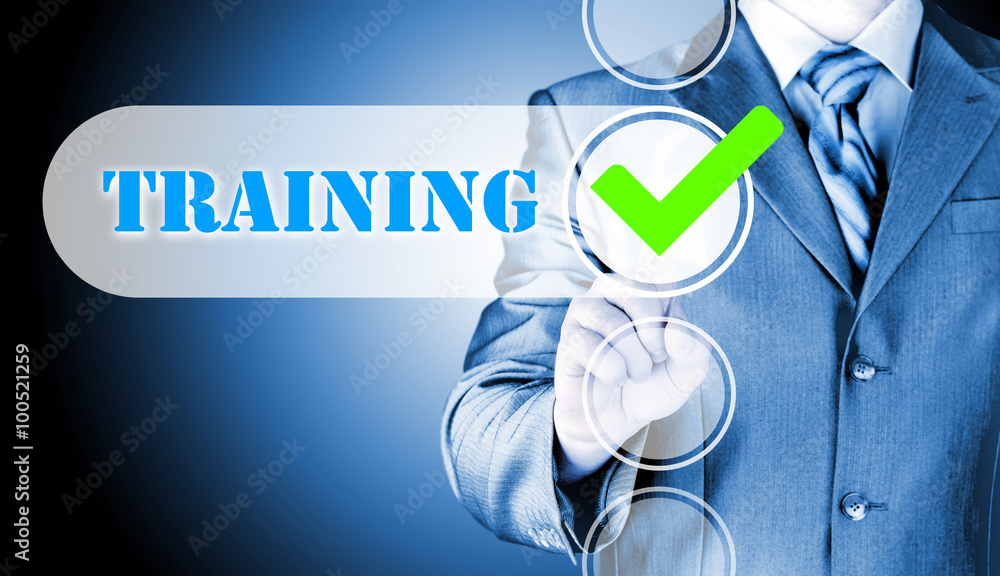Businessman pressing touch screen interface training checkbox Businessman pressing touch screen interface training checkbox