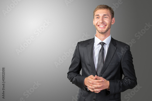 Young handsome businessman smiling