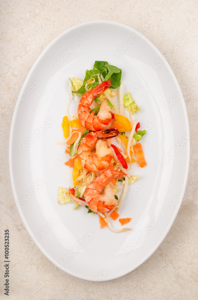 shrimps with salad on a white plate shrimps with salad on a white plate