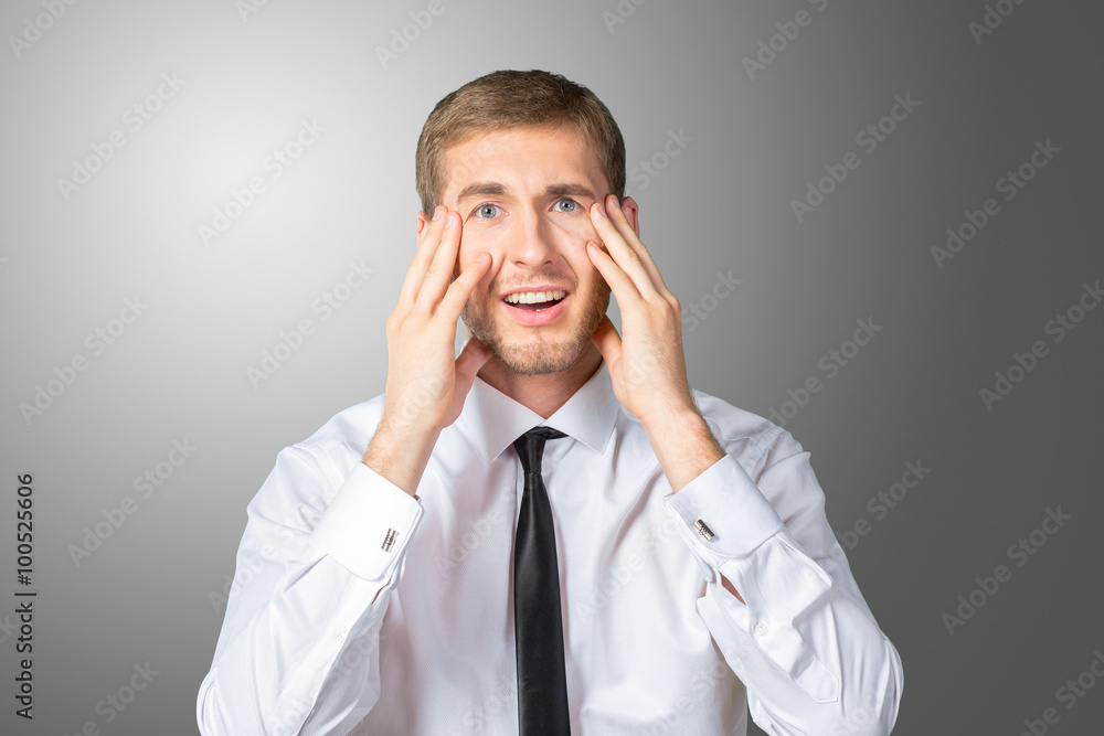 Scared and astonished young businessman Scared and astonished young businessman