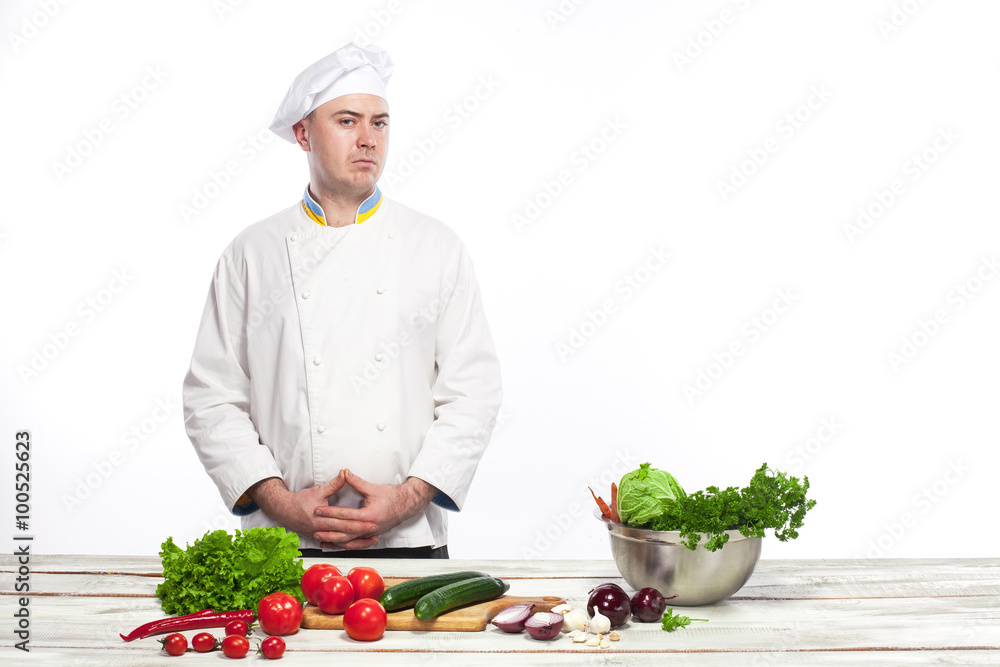 Chef cooking fresh vegetable salad in his kitchen Chef cooking fresh vegetable salad in his kitchen