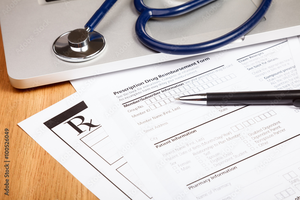 Rx prescription form with pen stethoscope and laptop computer Rx prescription form with pen stethoscope and laptop computer