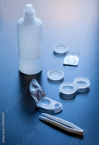 Oneday disposable contact lens open blister pack with case, lens solution and tweezers toned photo