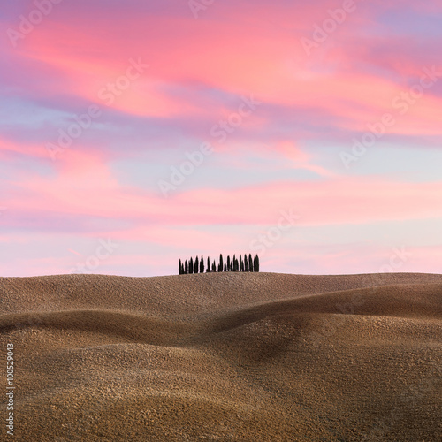Beautiful Tuscany Landscape with hills and cypresses at sundown