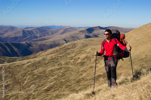  Hiker trekking in the mountains.