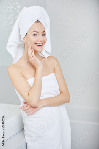 Fresh Young Woman Wrapped with Towels After Bath, Smiling at the
