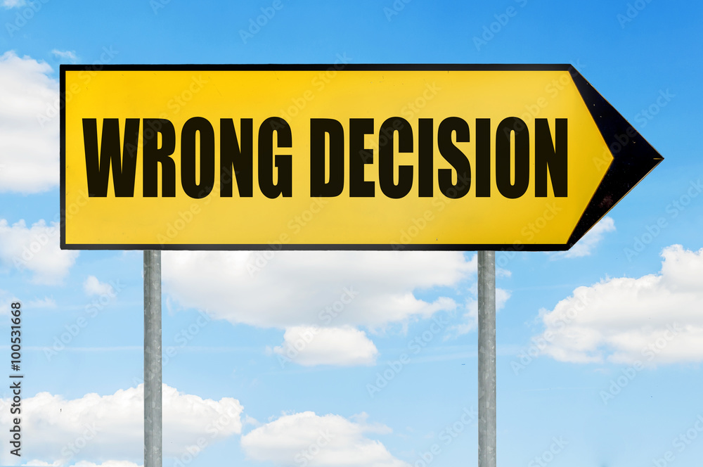 Fototapeta premium Wrong decision Sign -Yellow road sign with arrow pointing right against blue cloudy sky