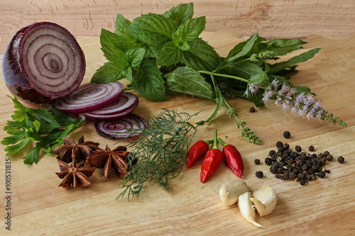Fototapeta Naklejka Na Ścianę i Meble -  Herbs and spices - parsley, onion, chilly, anise, garlic