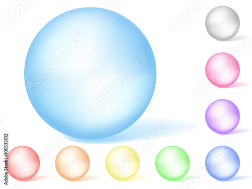 Set of multicolored translucent spheres on white background