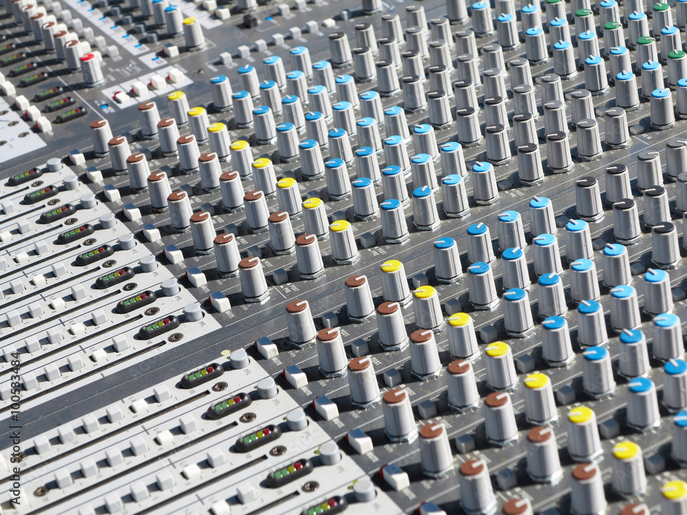 Giant audio sound mixer with color buttons and sliders