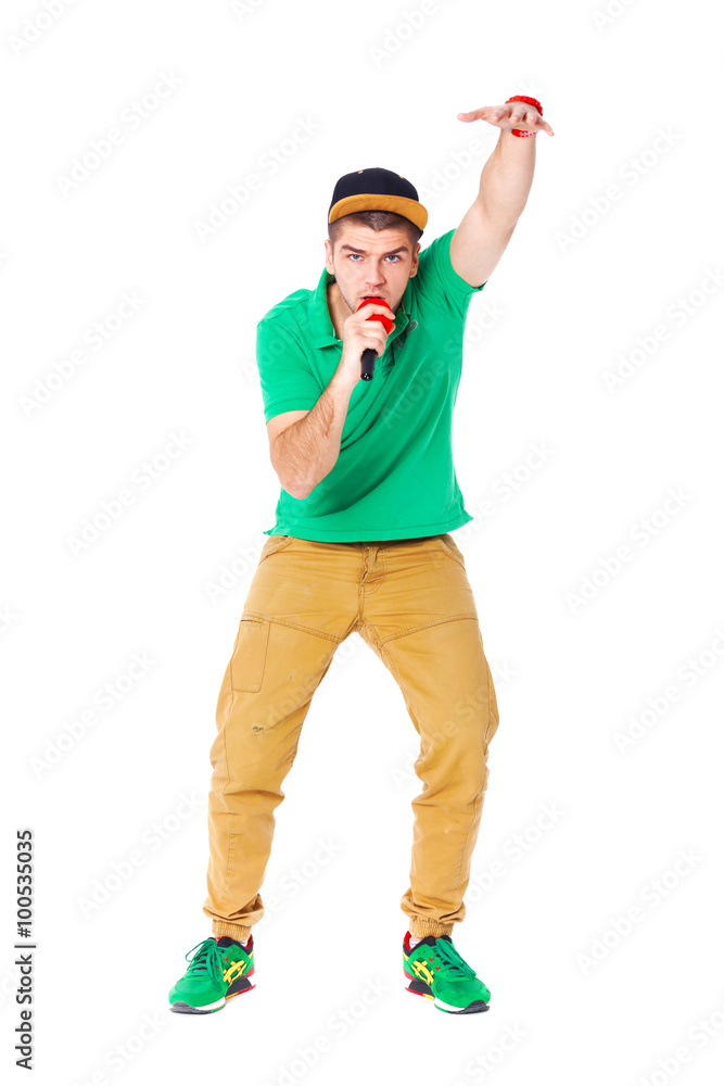 Portrait of young male hip hopper singing in studio isolated on Portrait of young male hip hopper singing in studio isolated on